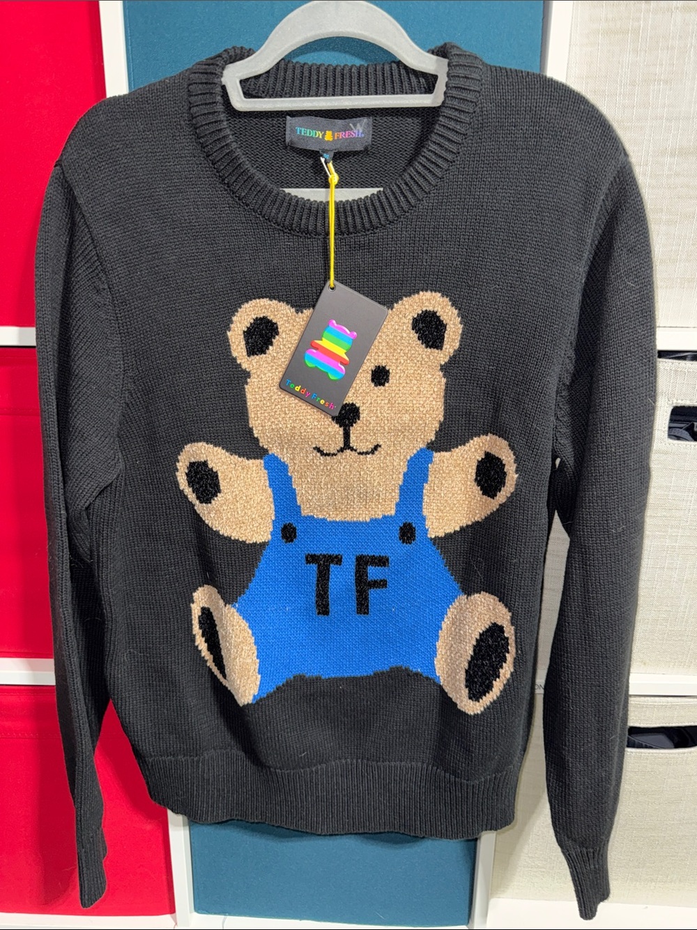 Teddy Fresh Black Crewneck Sweater with Tan Bear and Blue Overalls